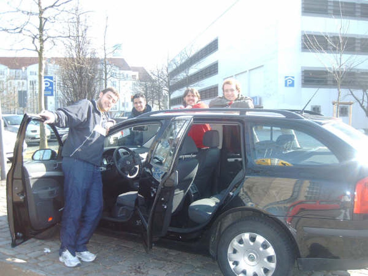 The Four of Us with the Car